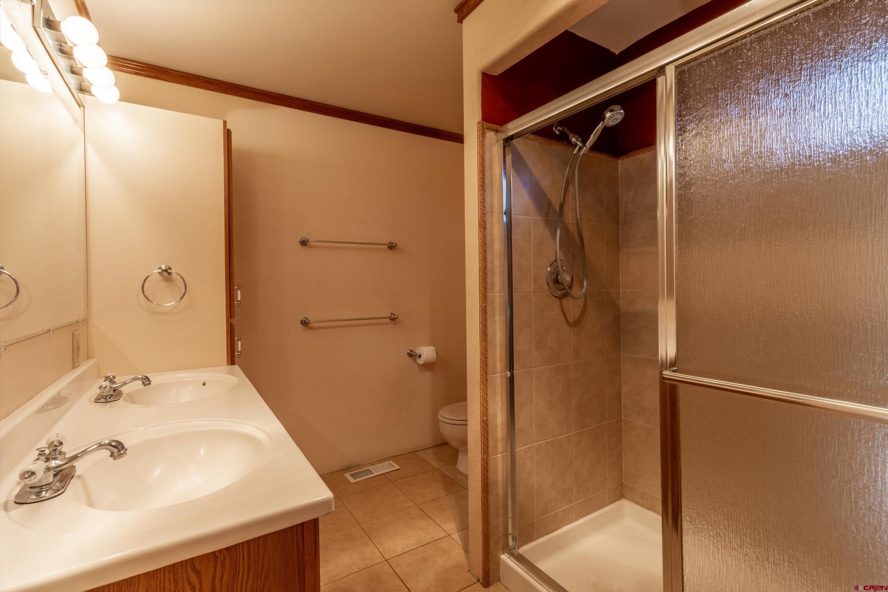 327 Hermosa Circle Durango, CO 81301 - Photo 10 of 32 a bathroom with a shower and a sink