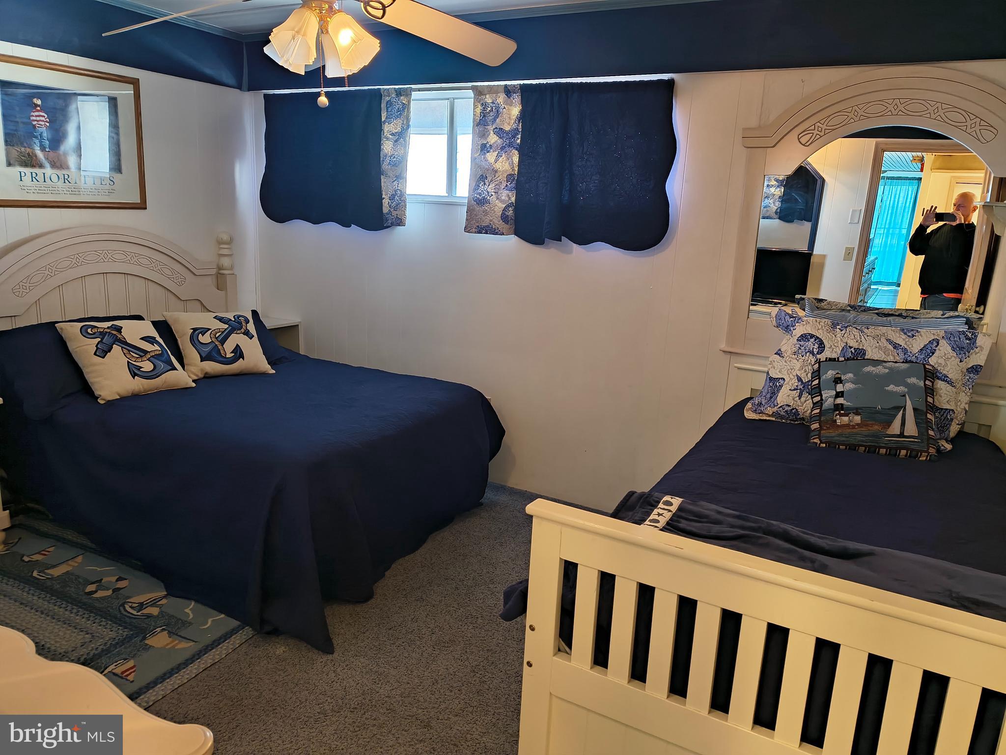 6803 Atlantic Avenue, Unit 4L Ocean City, MD 21842 - Photo 17 of 34 a bedroom with a bed and dresser