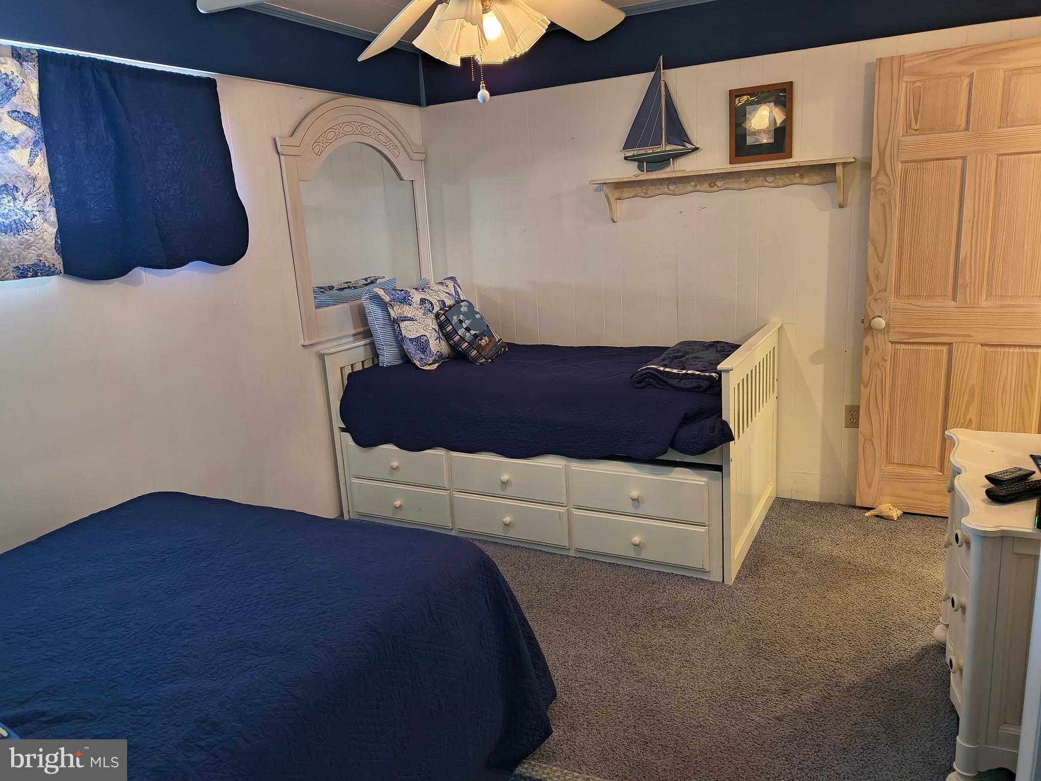 6803 Atlantic Avenue, Unit 4L Ocean City, MD 21842 - Photo 20 of 34 a bedroom with a bed and a cabinets