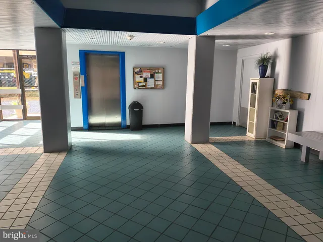 a view of a patio with couches chair and potted plants