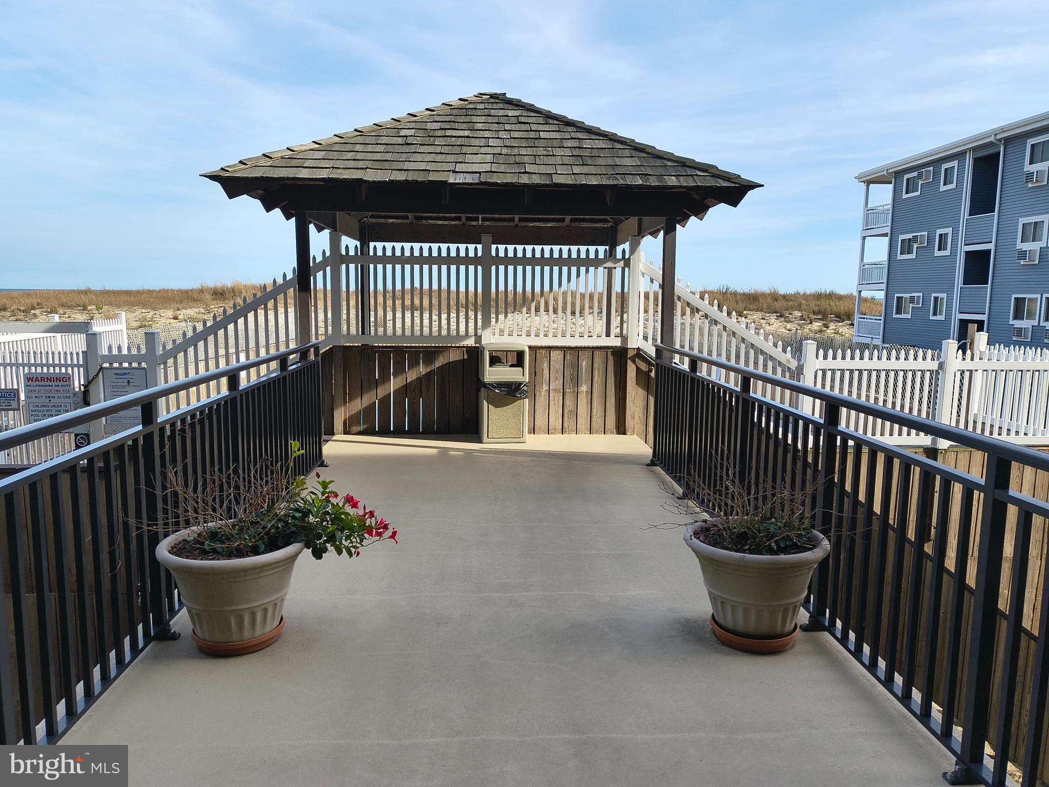 6803 Atlantic Avenue, Unit 4L Ocean City, MD 21842 - Photo 32 of 34 a view of a patio with couches chair and potted plants