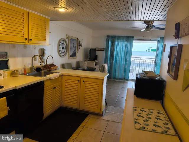a living room with furniture a mirror and a clock