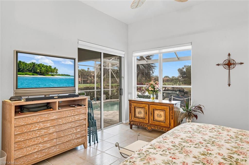 5735 Persimmon Way Naples, FL 34110 - Photo 11 of 49 Bedroom featuring light tile patterned floors, access to outside, and ceiling fan
