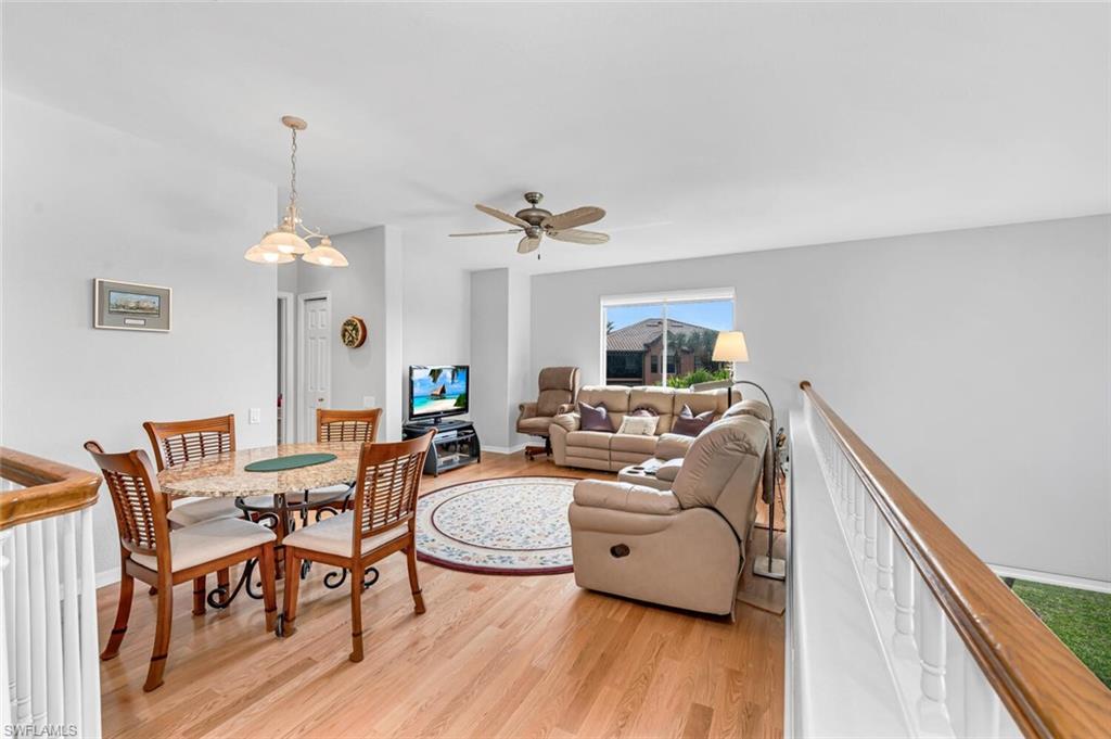 5735 Persimmon Way Naples, FL 34110 - Photo 16 of 49 Living room with light hardwood / wood-style flooring