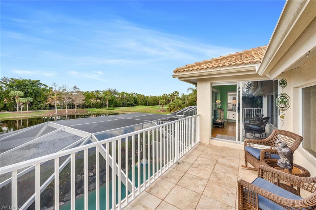 5735 Persimmon Way Naples, FL 34110 - Photo 22 of 49 Balcony featuring a patio and a water view