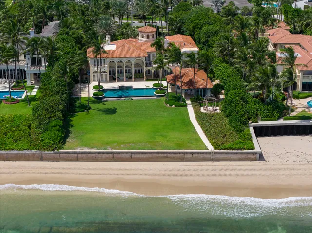 a view of yard with swimming pool and seating area