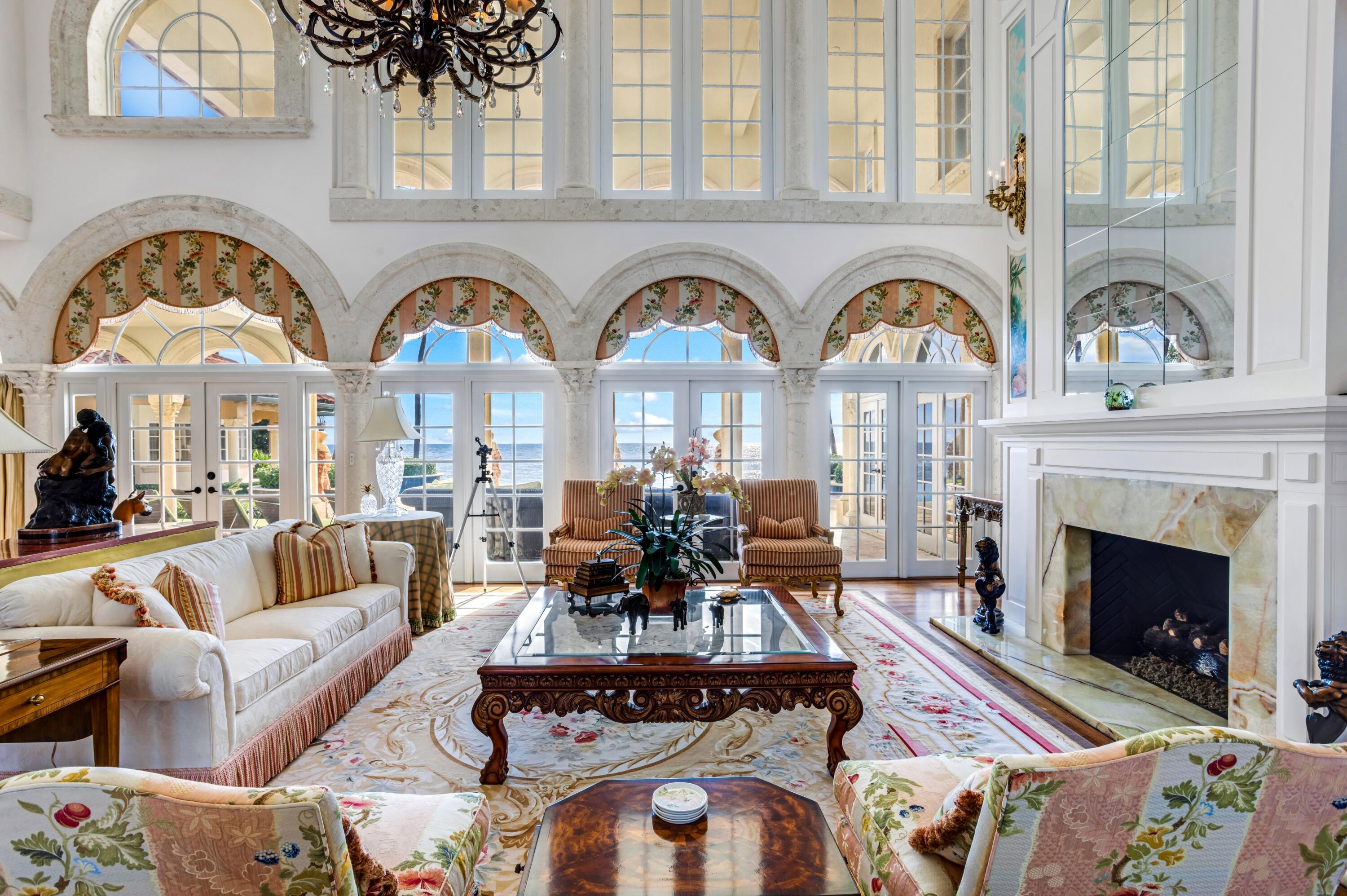 6133 North Ocean Boulevard Ocean Ridge, FL 33435 - Photo 11 of 64 a living room with fireplace furniture and a large window