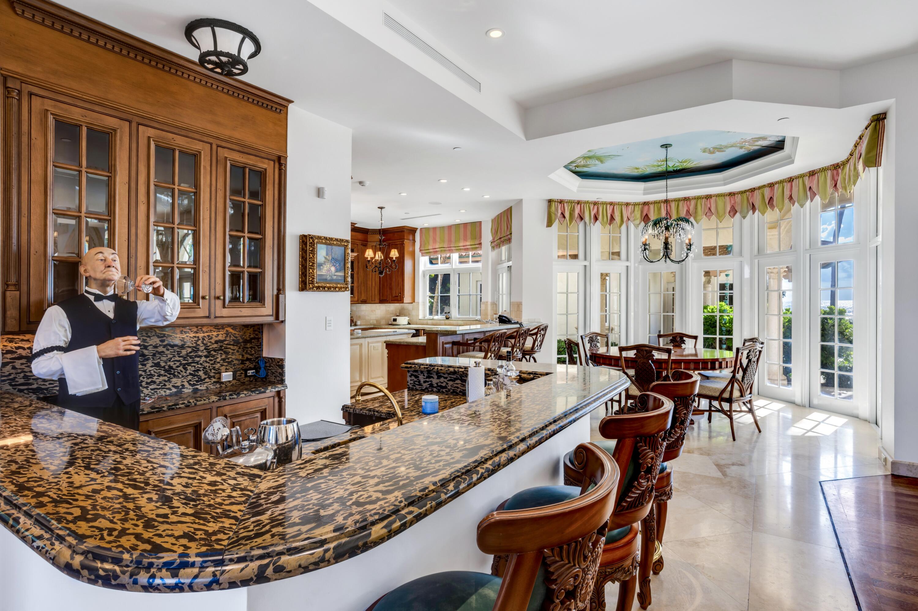 6133 North Ocean Boulevard Ocean Ridge, FL 33435 - Photo 17 of 64 a view of a dining room with furniture window and wooden floor