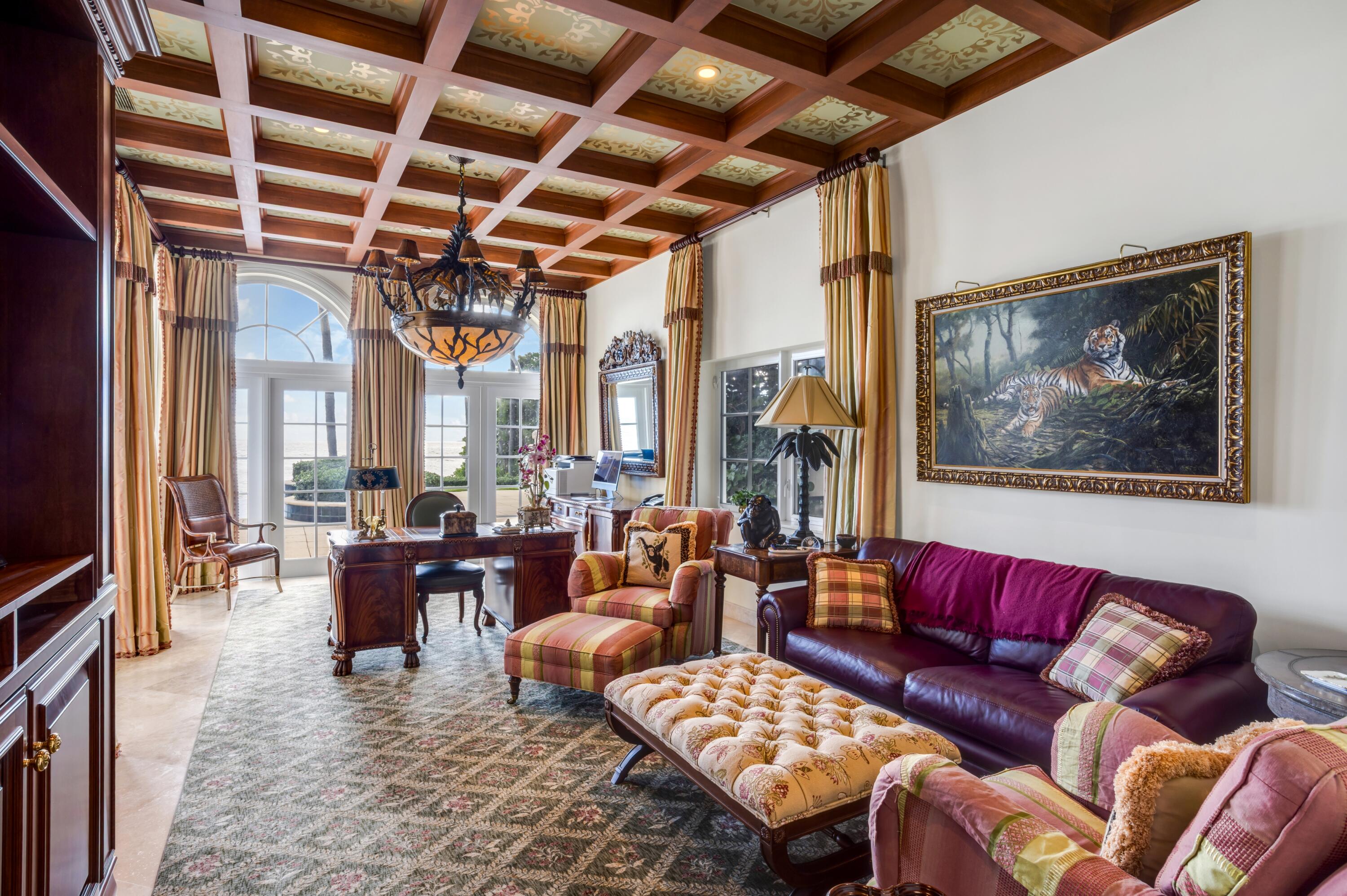 6133 North Ocean Boulevard Ocean Ridge, FL 33435 - Photo 20 of 64 a living room with furniture a fireplace and a flat screen tv