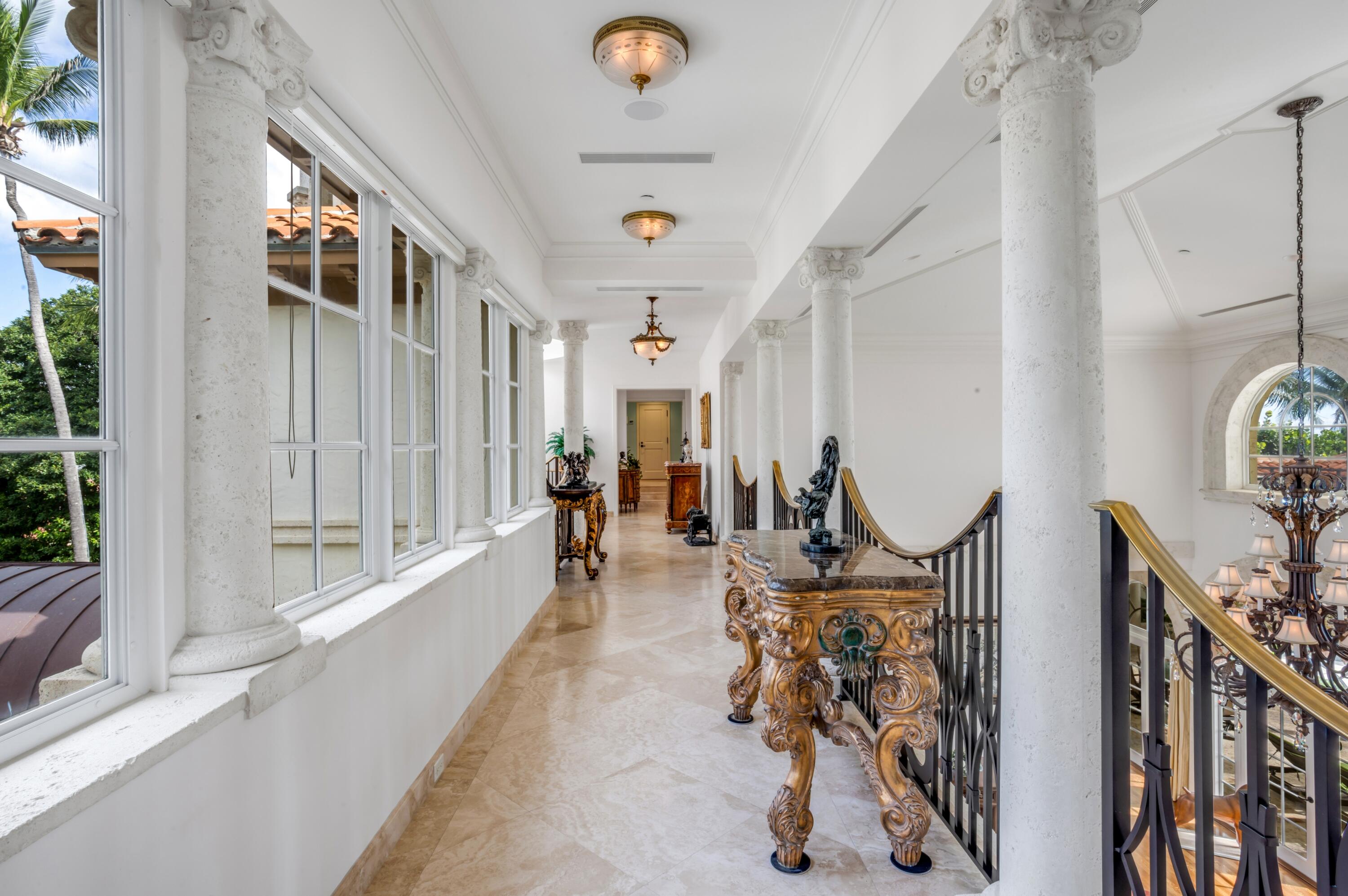 6133 North Ocean Boulevard Ocean Ridge, FL 33435 - Photo 26 of 64 a view of a hallway with wooden floor and windows