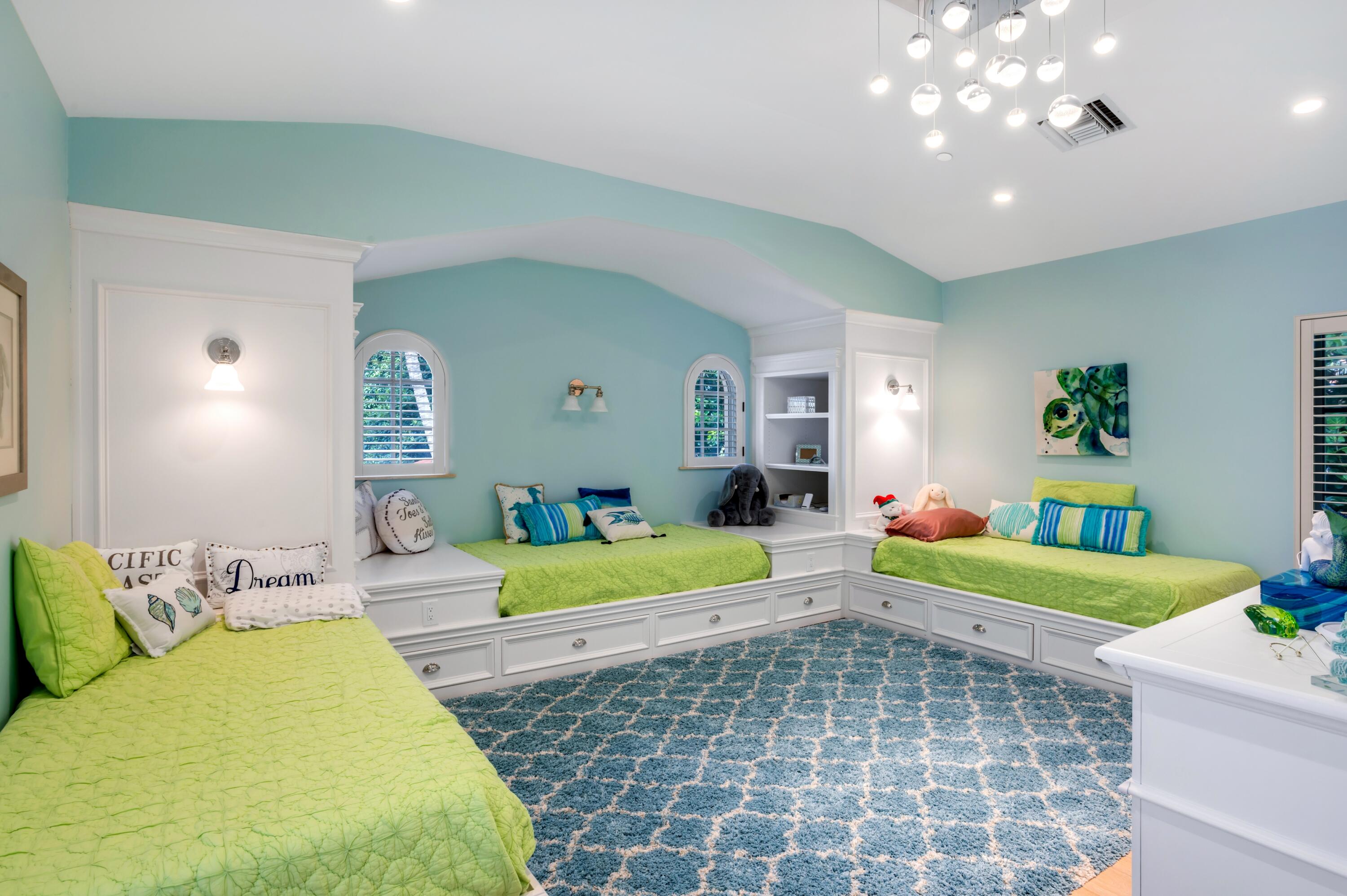 6133 North Ocean Boulevard Ocean Ridge, FL 33435 - Photo 28 of 64 a bedroom with a bed and a dresser