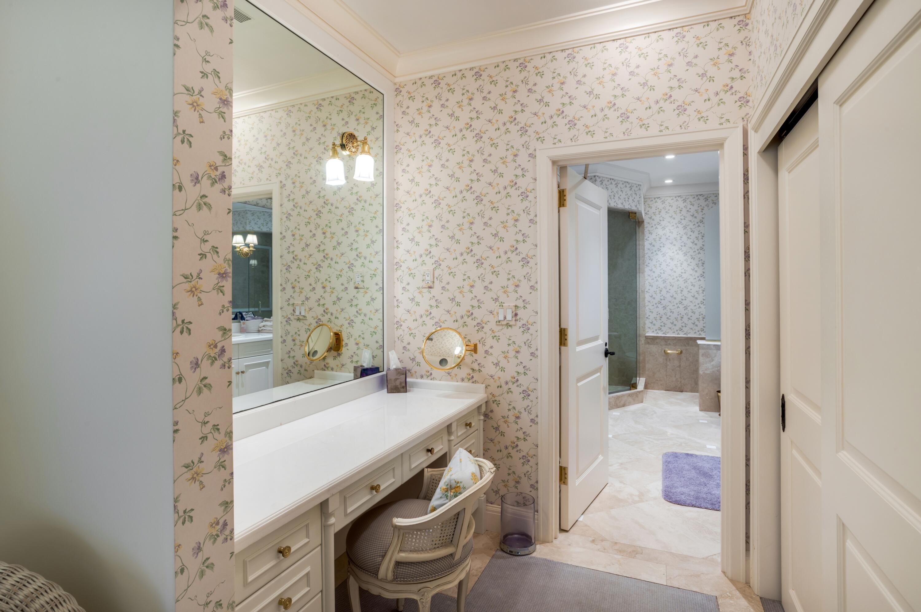 6133 North Ocean Boulevard Ocean Ridge, FL 33435 - Photo 35 of 64 a bathroom with a sink a mirror and a shower