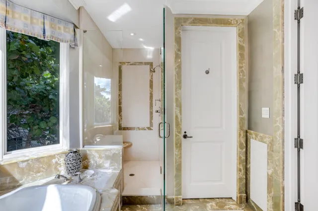 a view of a patio with table and chairs and potted plants