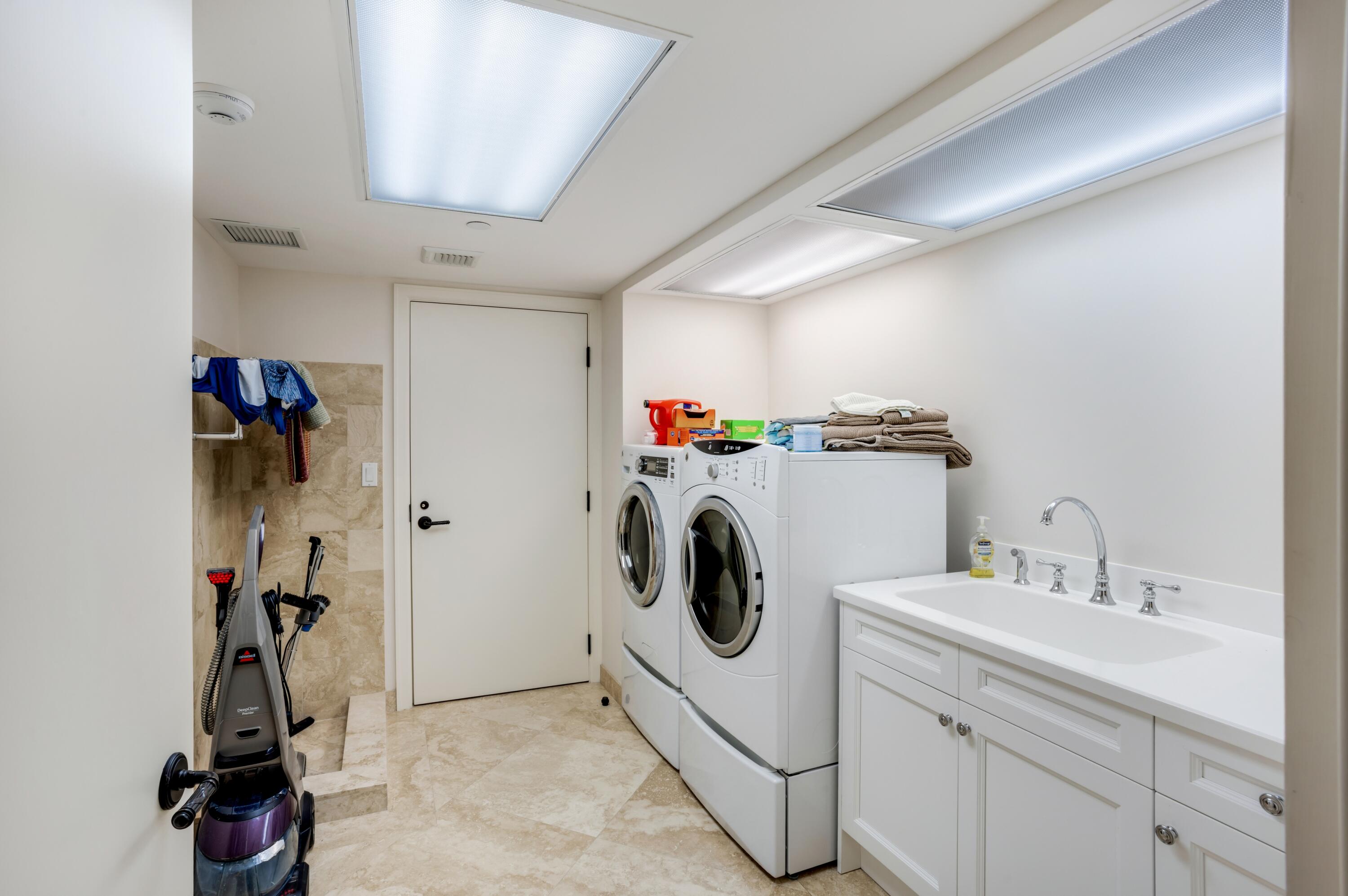 6133 North Ocean Boulevard Ocean Ridge, FL 33435 - Photo 41 of 64 a utility room with dryer and washer