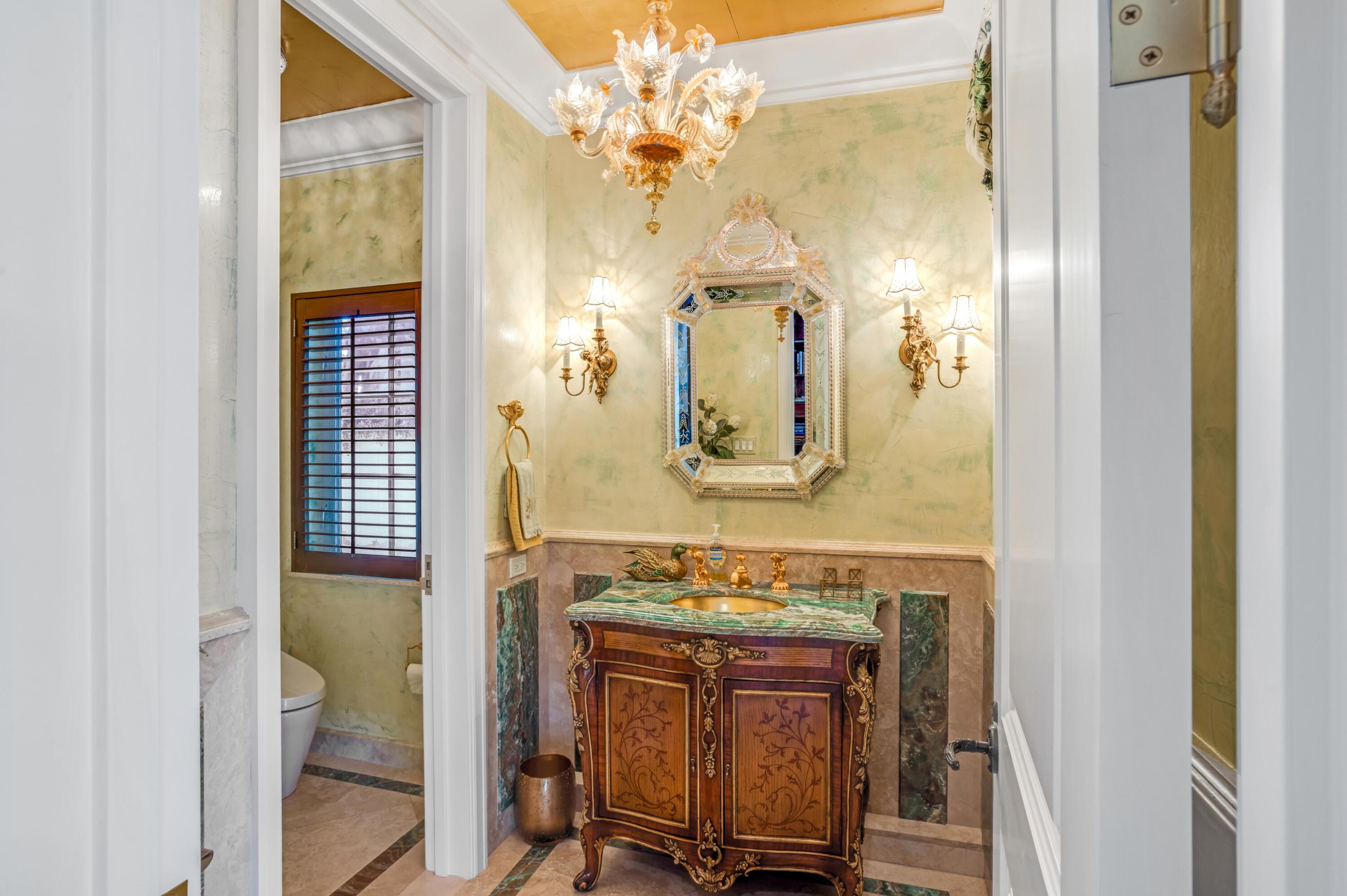 6133 North Ocean Boulevard Ocean Ridge, FL 33435 - Photo 44 of 64 a bathroom with a sink and a mirror