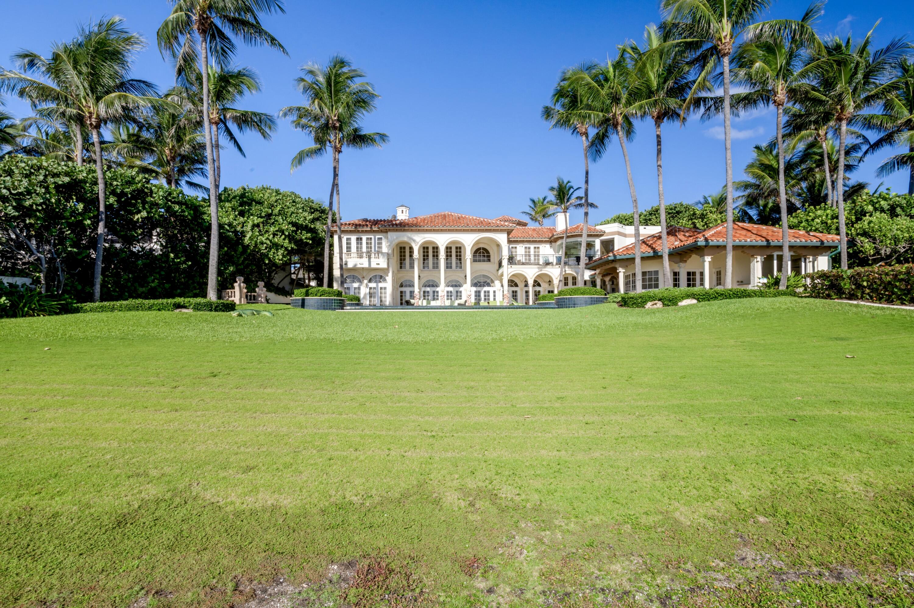 6133 North Ocean Boulevard Ocean Ridge, FL 33435 - Photo 46 of 64 a view of a house with a yard and potted plants