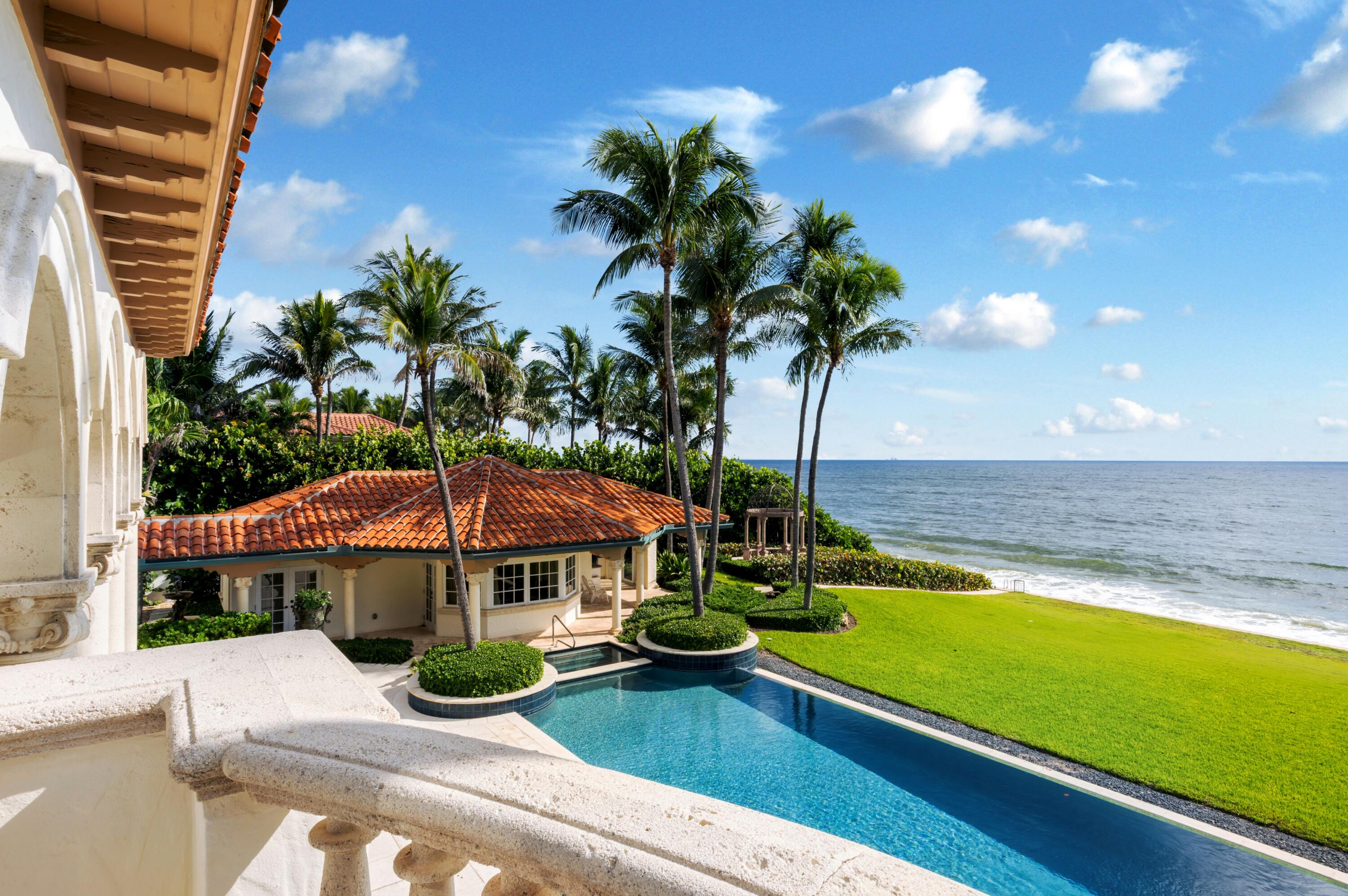 6133 North Ocean Boulevard Ocean Ridge, FL 33435 - Photo 48 of 64 a view of a house with swimming pool and sitting area