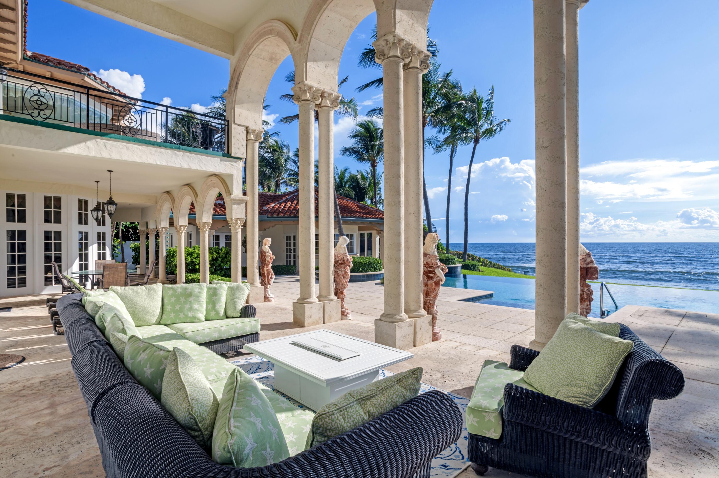 6133 North Ocean Boulevard Ocean Ridge, FL 33435 - Photo 51 of 64 a view of a patio with couches and potted plants