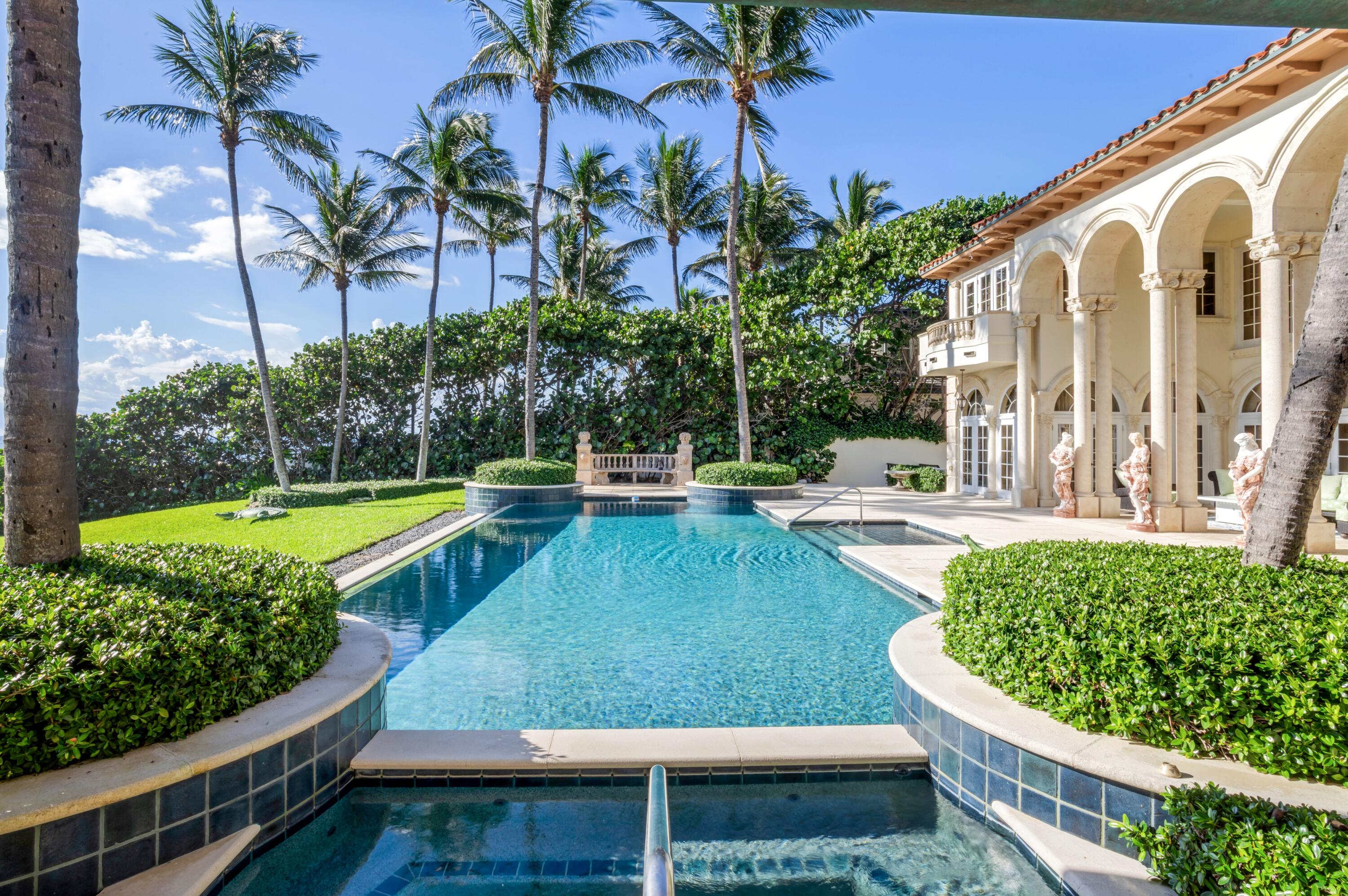 6133 North Ocean Boulevard Ocean Ridge, FL 33435 - Photo 55 of 64 a view of a swimming pool with a patio
