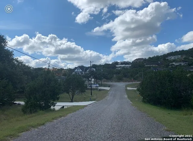 a view of a lake with a yard