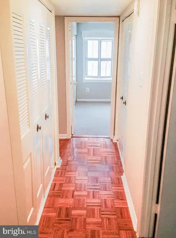a view of hallway with windows