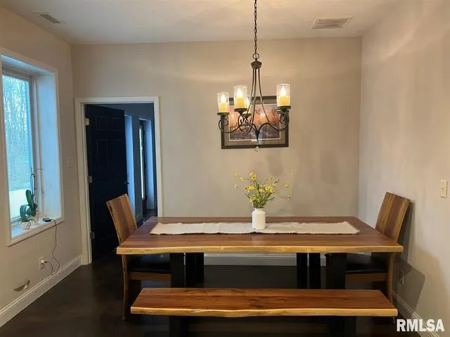 a kitchen with stainless steel appliances granite countertop a sink refrigerator and microwave