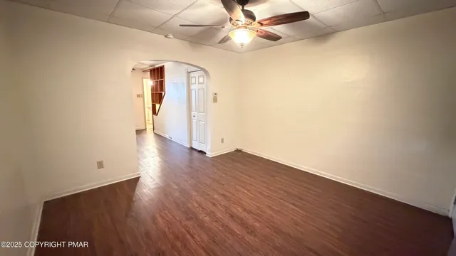 a view of a livingroom with furniture and wooden floor