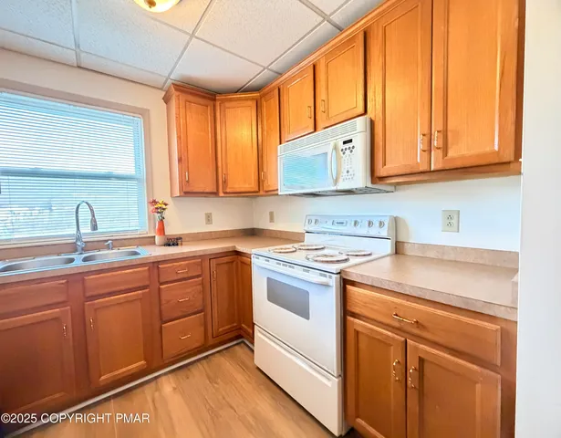 a bathroom with a sink toilet and mirror