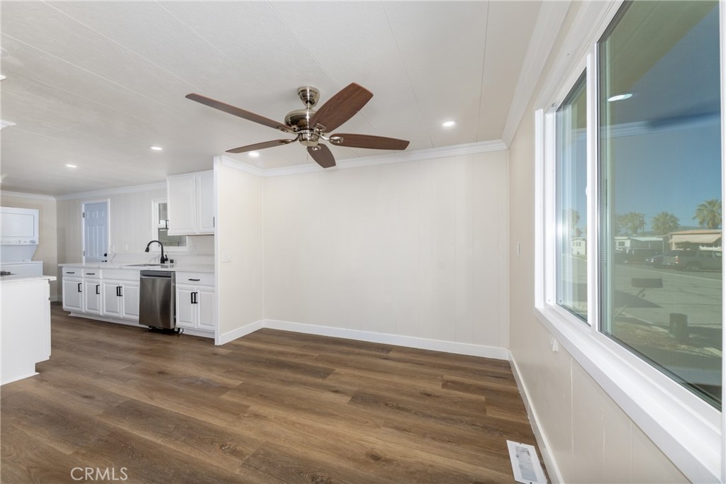 65 Round Table Drive, Unit 65 Riverside, CA 92507 - Photo 12 of 36 a view of a kitchen with a sink and dishwasher a refrigerator with wooden floor