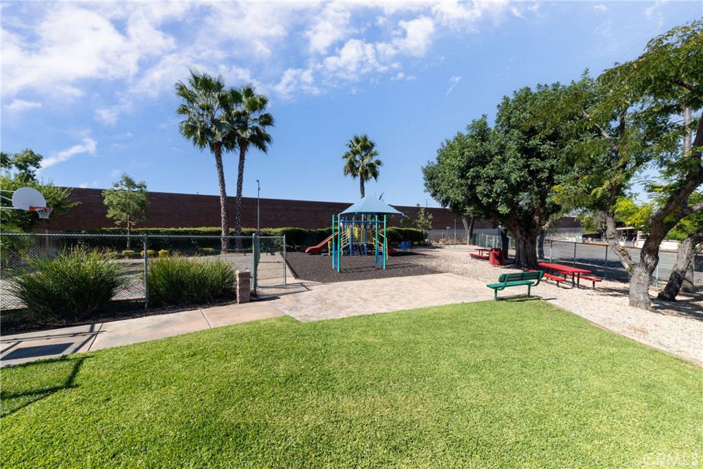 65 Round Table Drive, Unit 65 Riverside, CA 92507 - Photo 33 of 36 a view of a garden with plants and a lake view