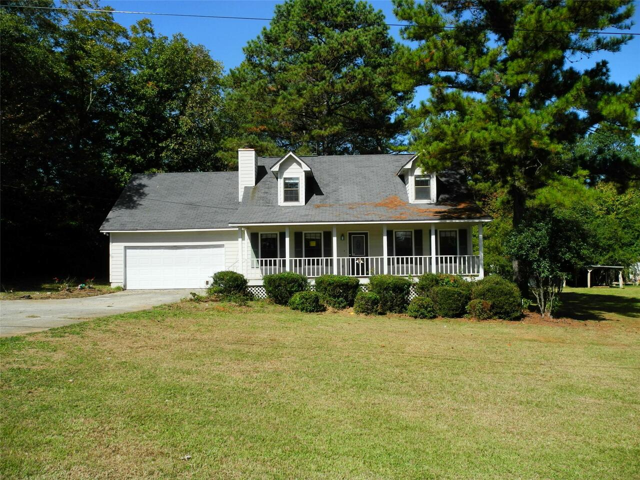 4355 Rex Road, Unit 8 Rex, GA 30273 - Photo 1 of 1 a front view of a house with a yard