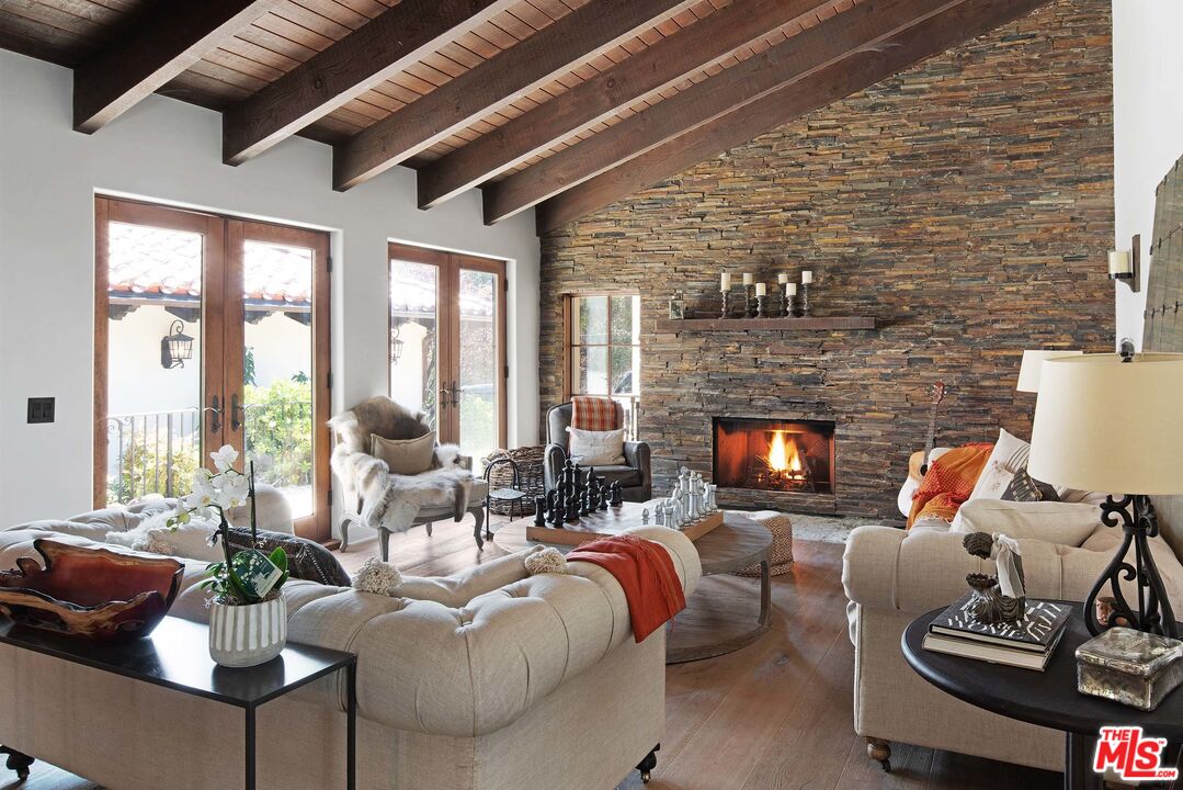 2251 Cold Canyon Road Calabasas, CA 91302 - Photo 6 of 47 a living room with furniture and a fireplace