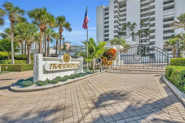 a sign board on the side of a street