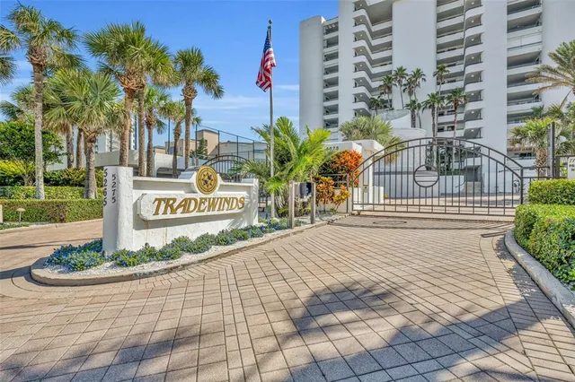 a sign board on the side of a street