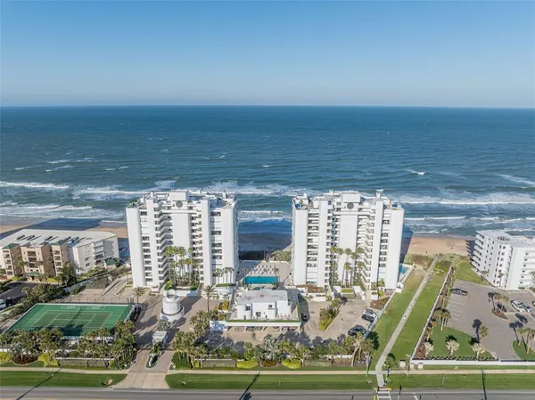 a view of a city with an ocean view