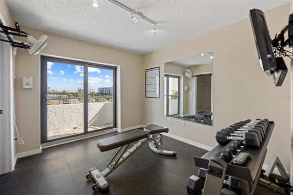 a view of a swimming pool with outdoor seating