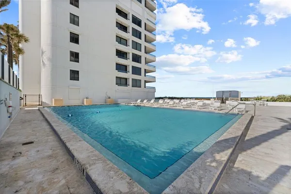 a view of a balcony with furniture