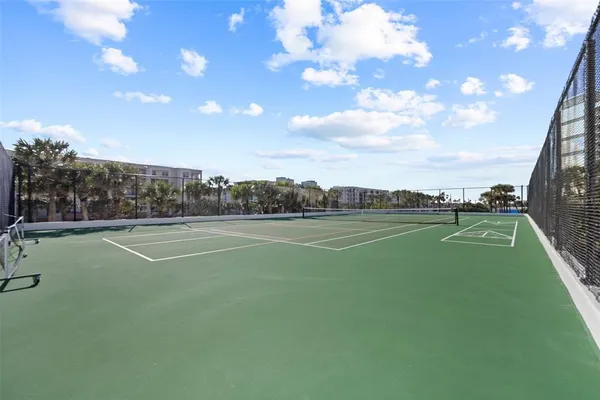 a view of swimming pool with outdoor seating and plants