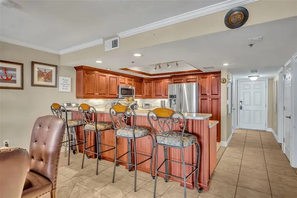 a room with lots of chairs and mirrors