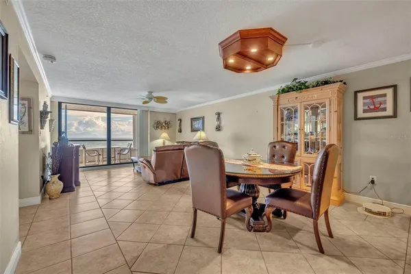 a dining room with furniture and chandelier