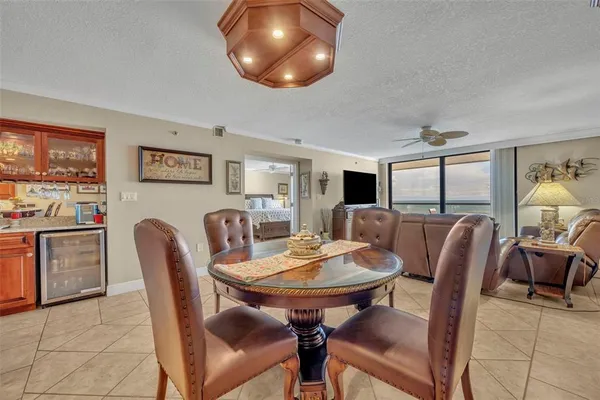 a view of a dining room with furniture and window