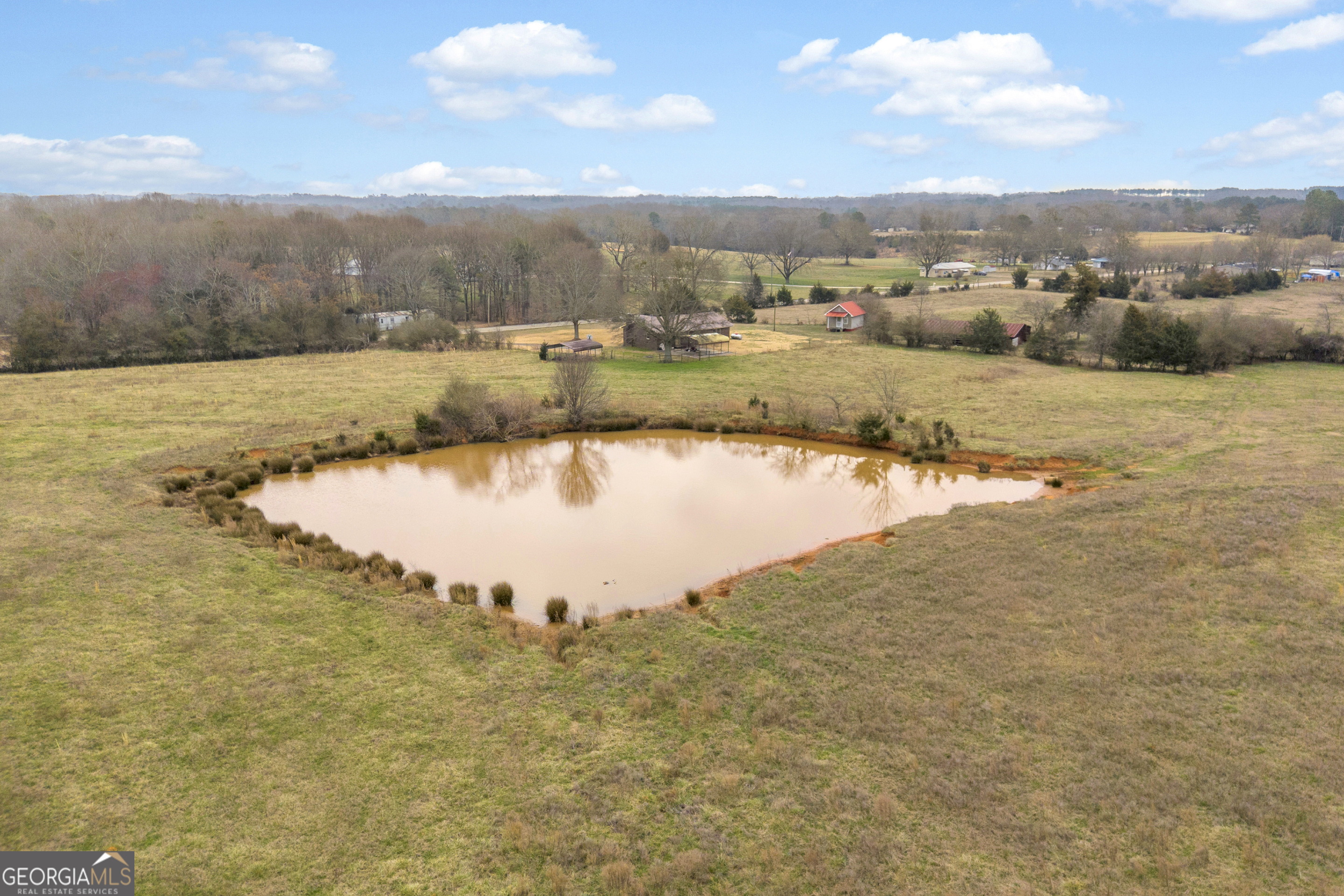 7743 Mt Olivet Road Hartwell, GA 30643 - Photo 21 of 42 a view of a lake with houses in the back