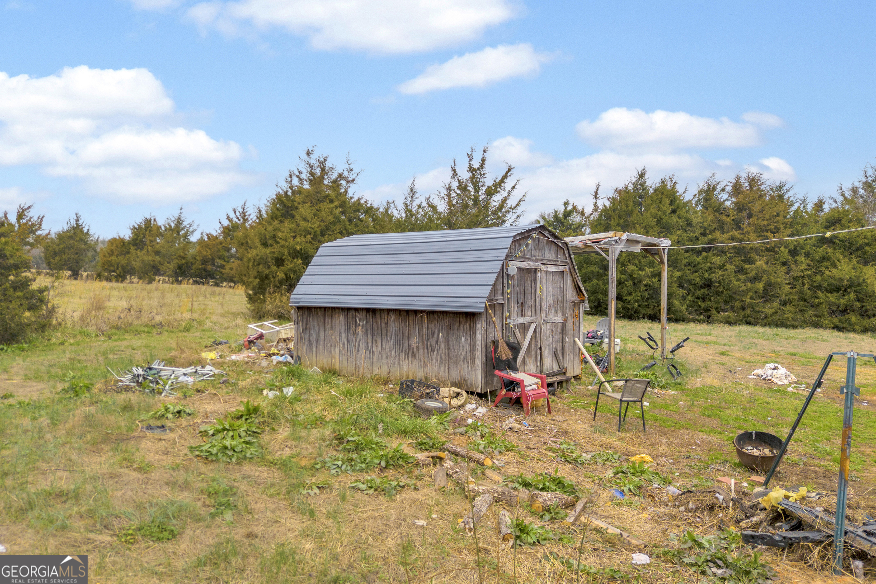 7743 Mt Olivet Road Hartwell, GA 30643 - Photo 27 of 42 a view of backyard with swimming pool and seating
