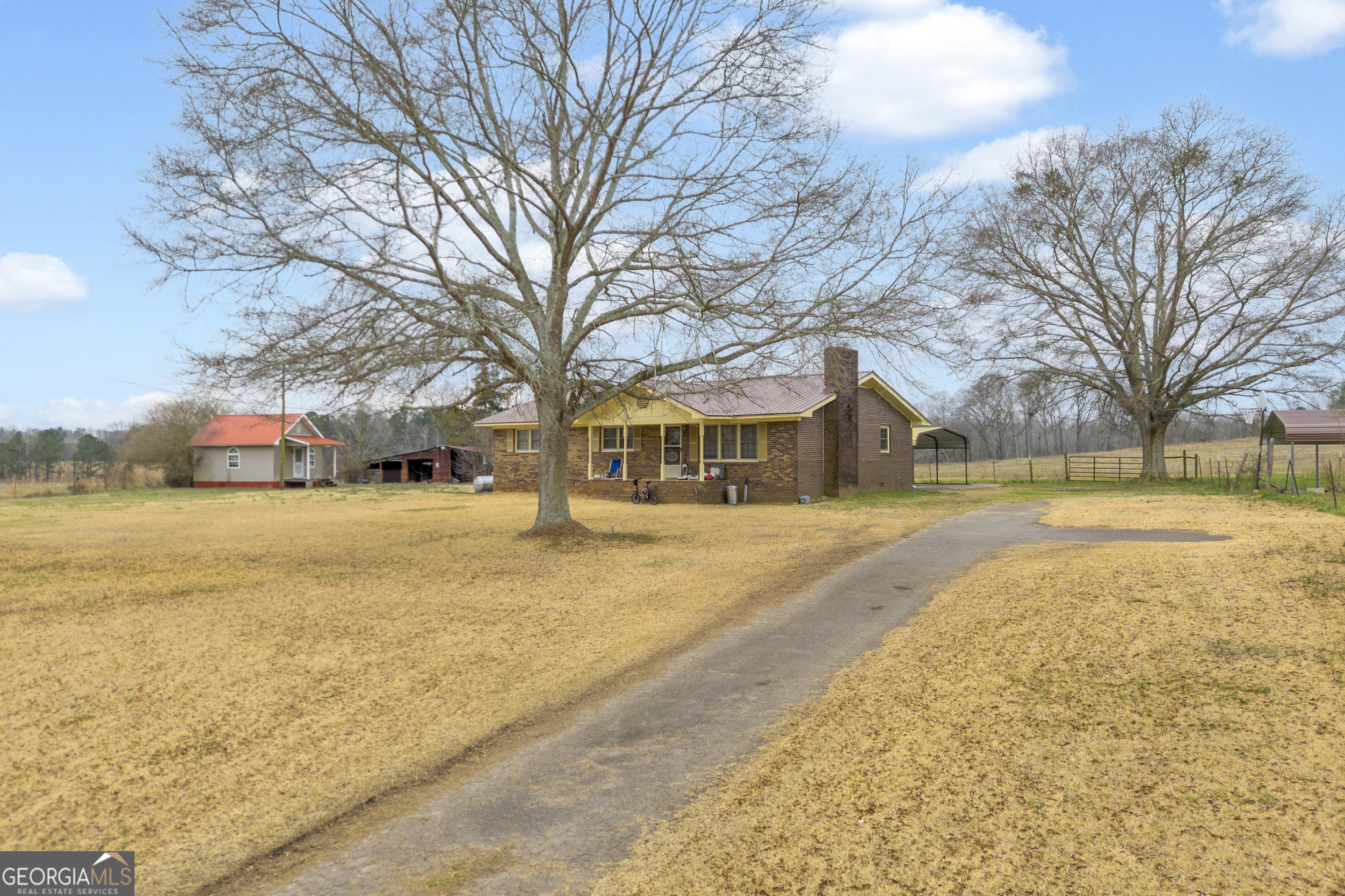 7743 Mt Olivet Road Hartwell, GA 30643 - Photo 33 of 42 a front view of residential houses with yard and trees