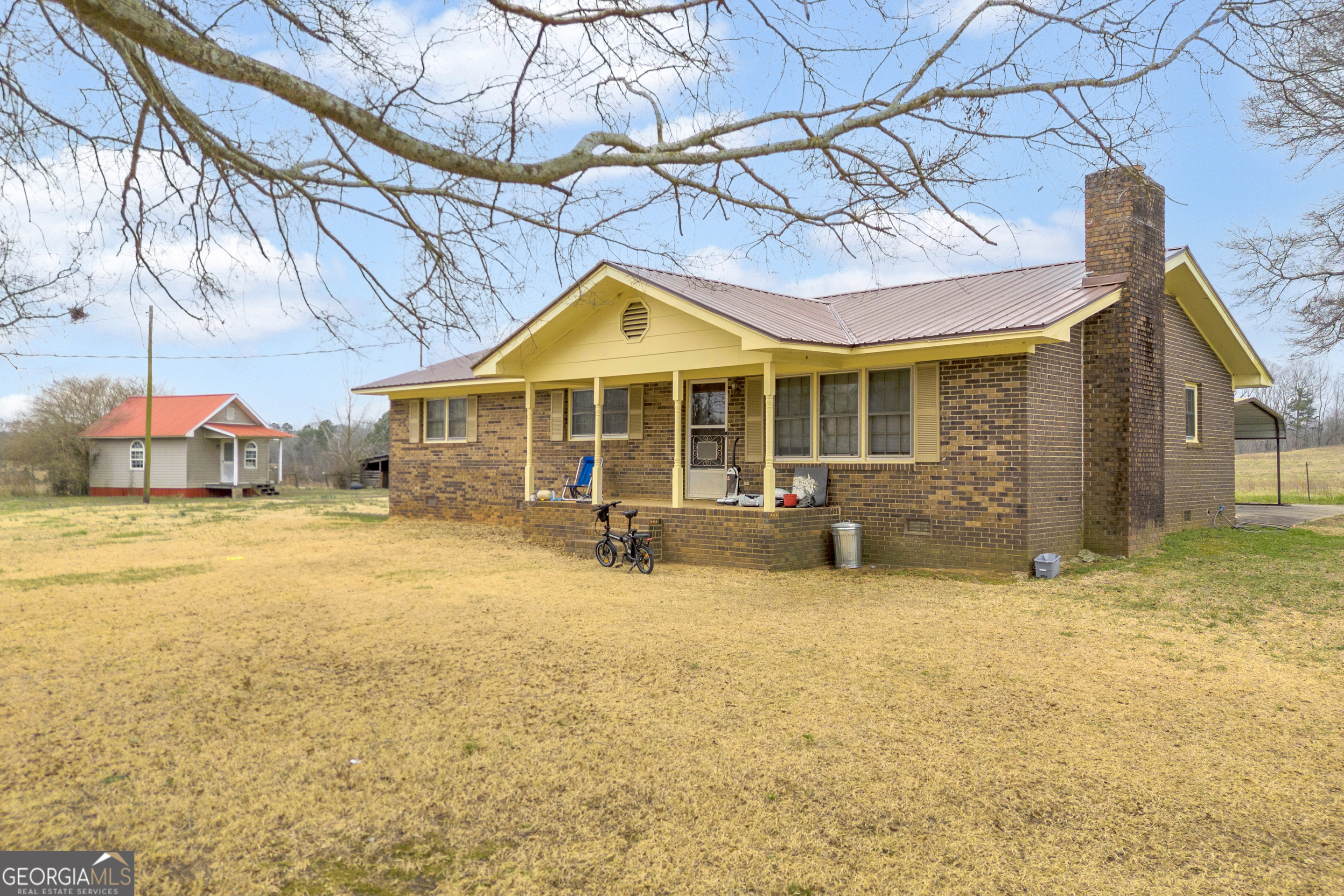 7743 Mt Olivet Road Hartwell, GA 30643 - Photo 40 of 42 a view of a house with a yard patio and a tub