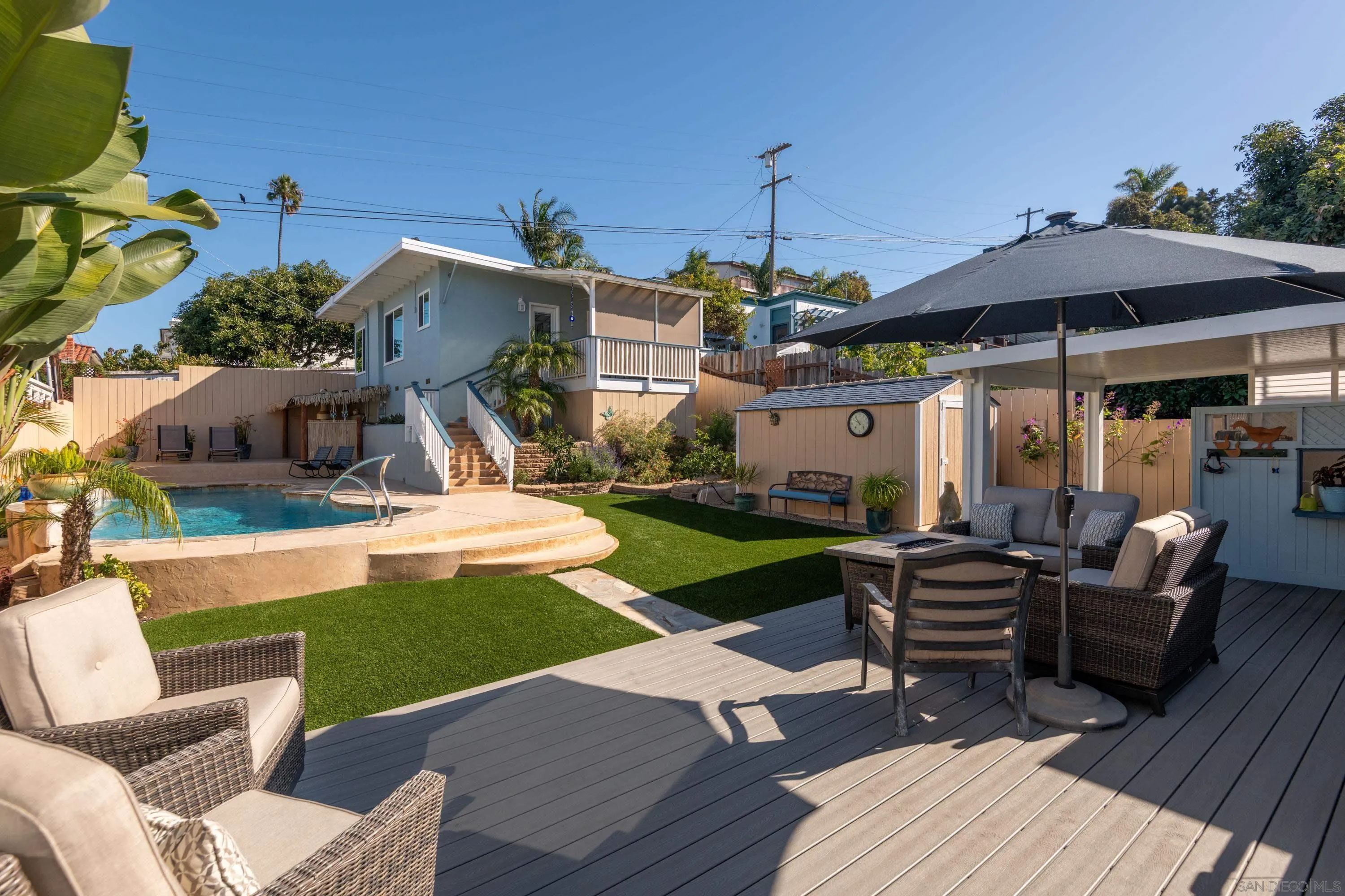 4484 Orchard Avenue San Diego, CA 92107 - Photo 15 of 36 a view of a patio with couches chairs and a fire pit