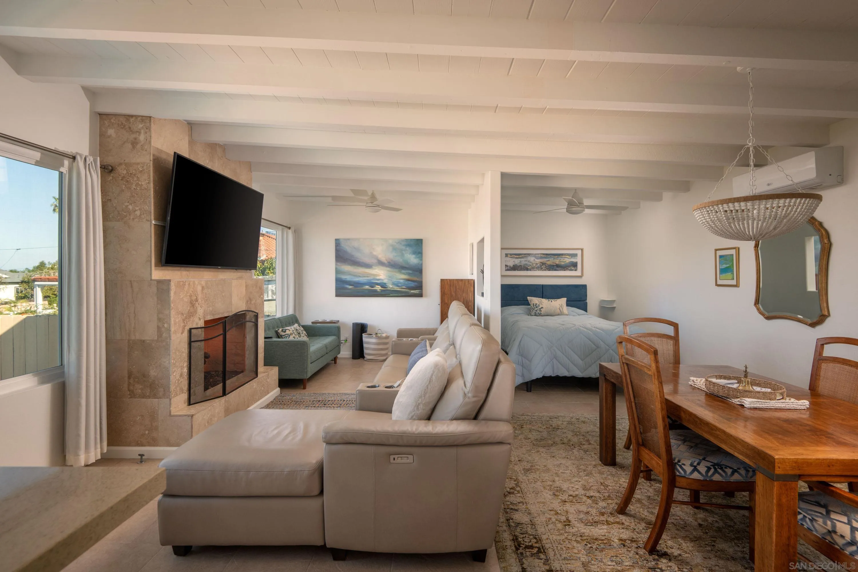 4484 Orchard Avenue San Diego, CA 92107 - Photo 29 of 36 a living room with furniture and a flat screen tv