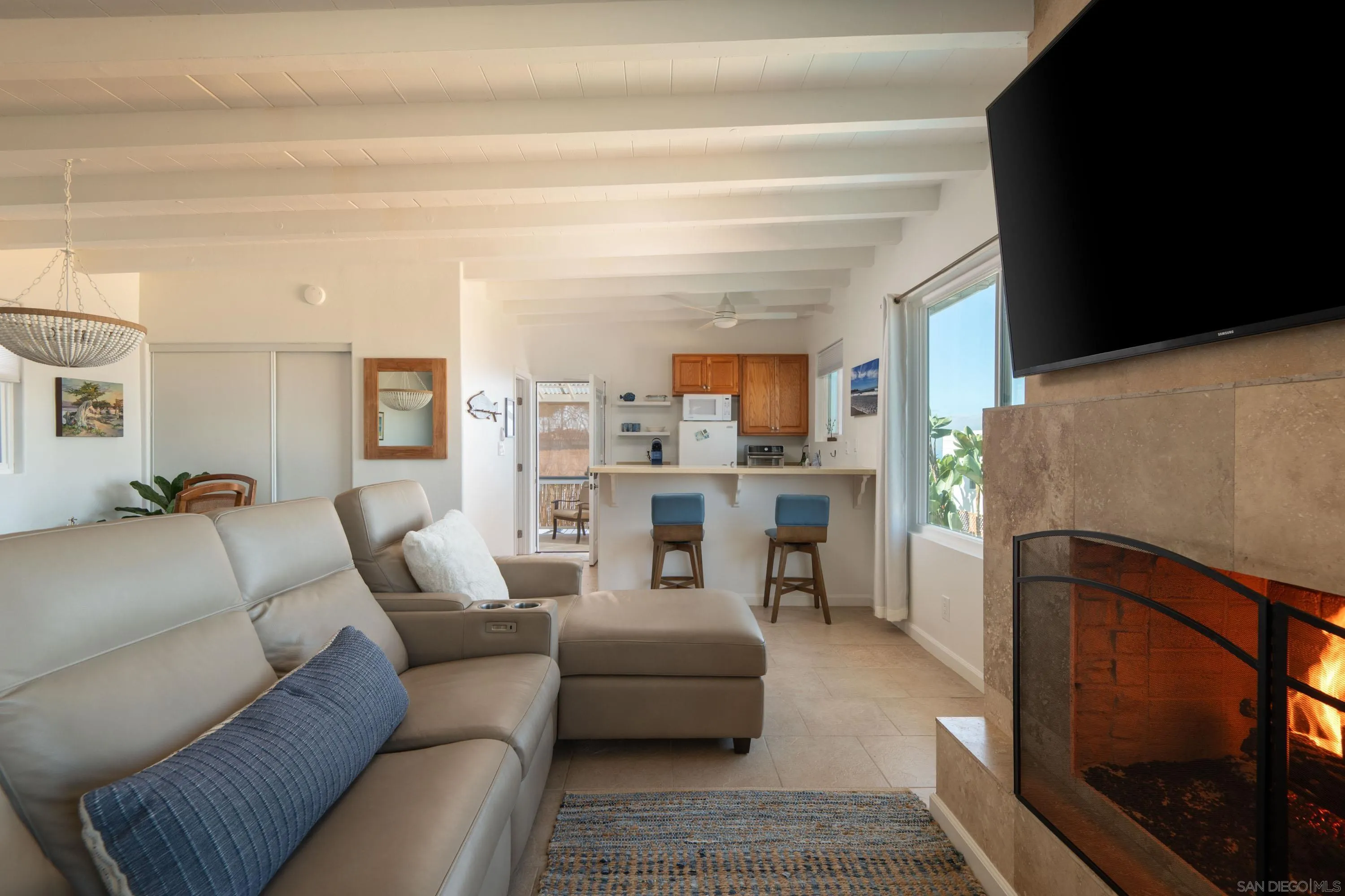 4484 Orchard Avenue San Diego, CA 92107 - Photo 30 of 36 a living room with furniture and a fireplace