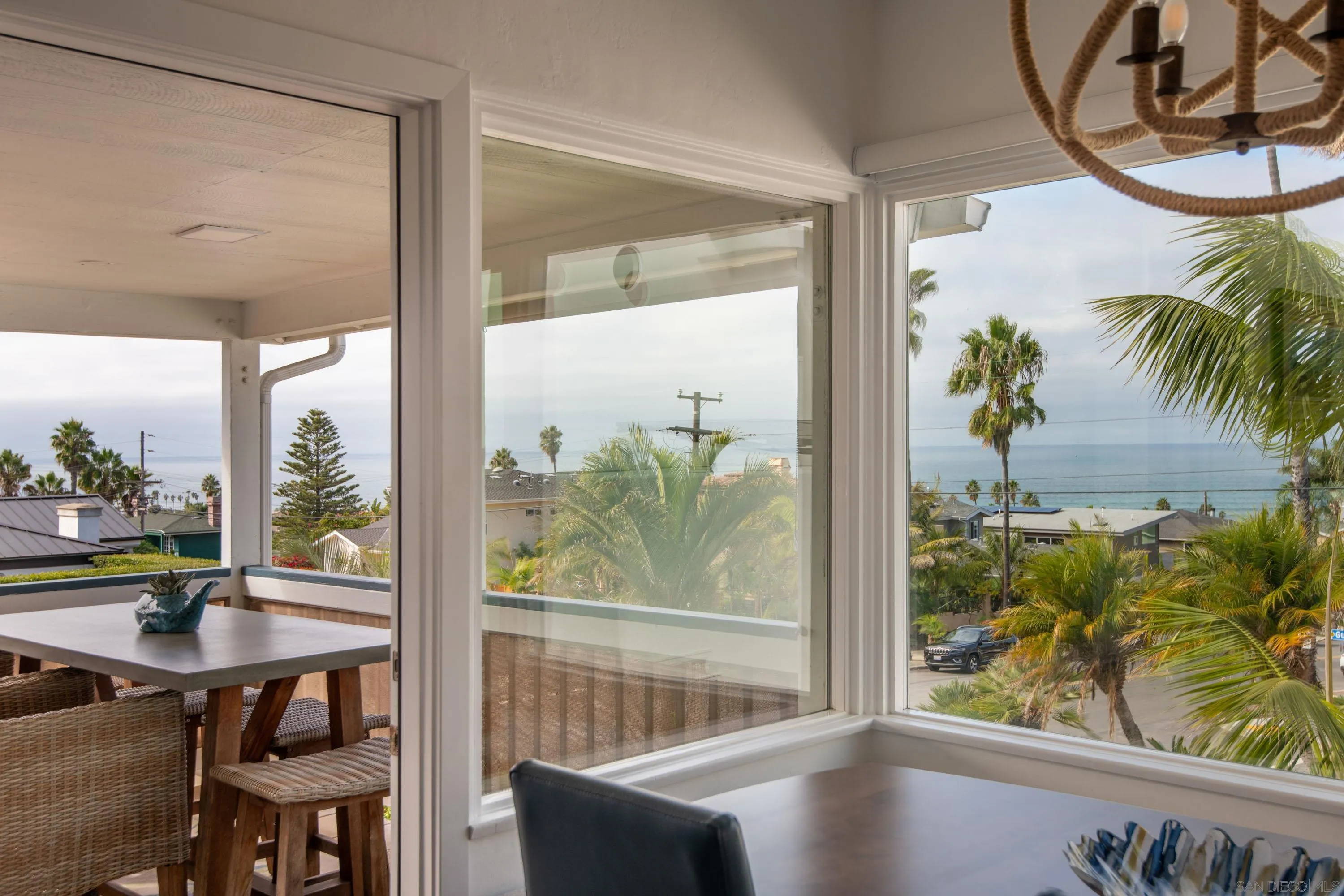 4484 Orchard Avenue San Diego, CA 92107 - Photo 8 of 36 a view of a floor to ceiling window with wooden floor