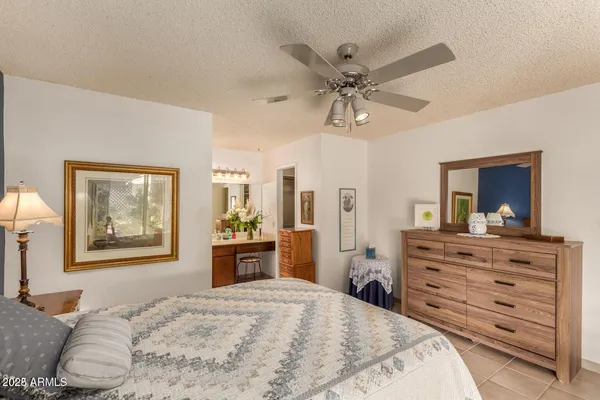 a bedroom with a bed and a dresser